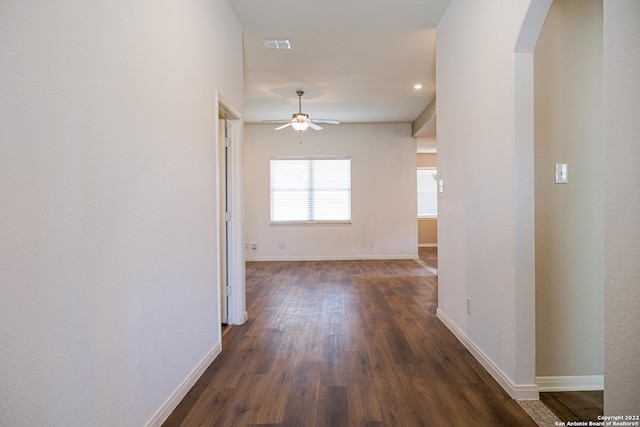 hallway with dark hardwood / wood-style flooring