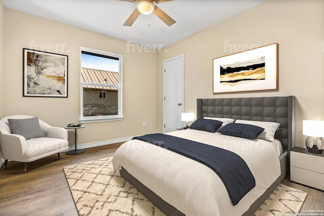 bedroom featuring hardwood / wood-style floors and ceiling fan