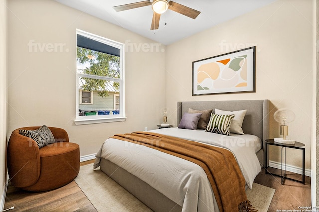 bedroom with ceiling fan and light wood-type flooring