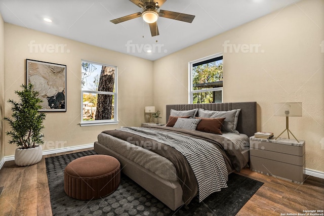 bedroom featuring dark hardwood / wood-style flooring and ceiling fan