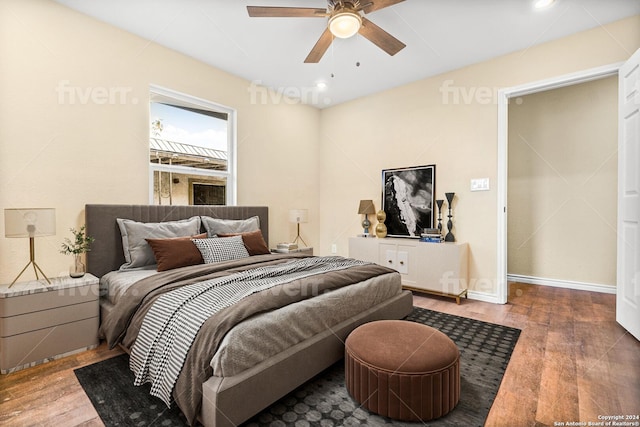 bedroom with ceiling fan and wood-type flooring