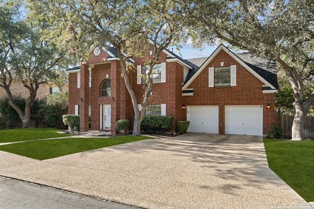 view of front of house featuring a garage and a front lawn