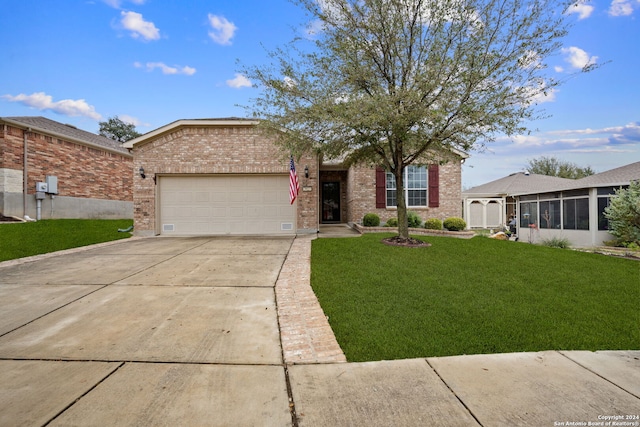 single story home with a garage and a front lawn