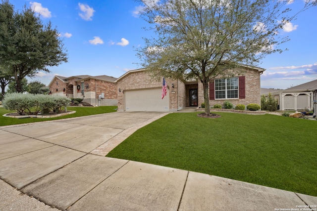 single story home featuring a garage and a front lawn