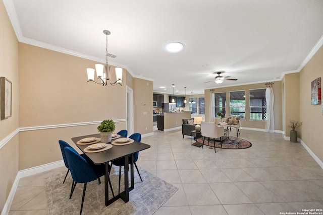 tiled dining space featuring ornamental molding and ceiling fan with notable chandelier