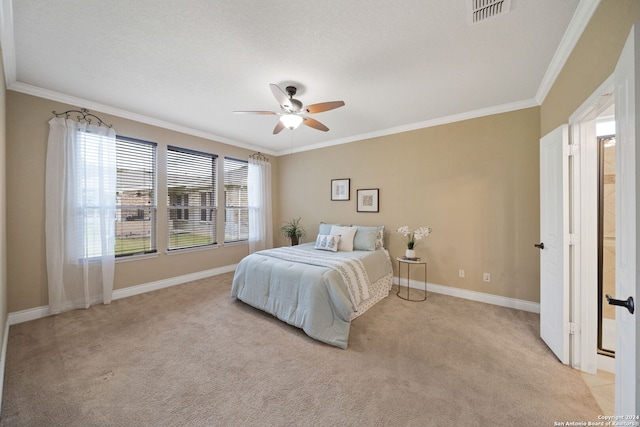 bedroom featuring ceiling fan, crown molding, and light colored carpet