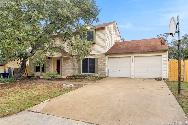 view of front facade featuring a garage and a front lawn