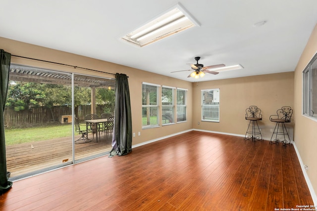 empty room featuring ceiling fan and hardwood / wood-style floors