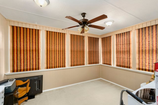 unfurnished room featuring ceiling fan and carpet floors