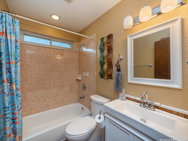 full bathroom with shower / tub combo with curtain, vanity, and toilet