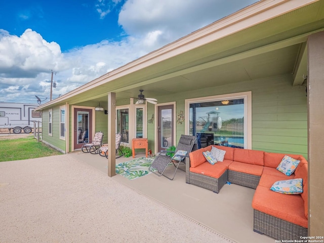 view of patio with outdoor lounge area and ceiling fan