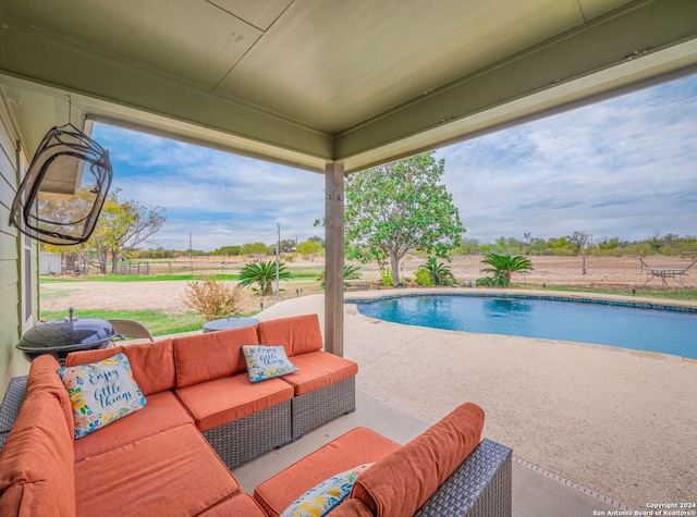 view of pool featuring a patio