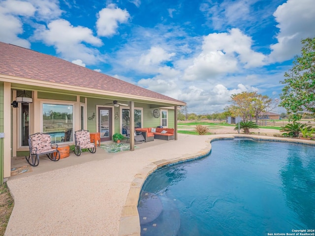 view of swimming pool with a patio, an outdoor hangout area, and ceiling fan