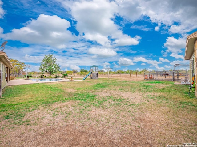 view of yard with a playground