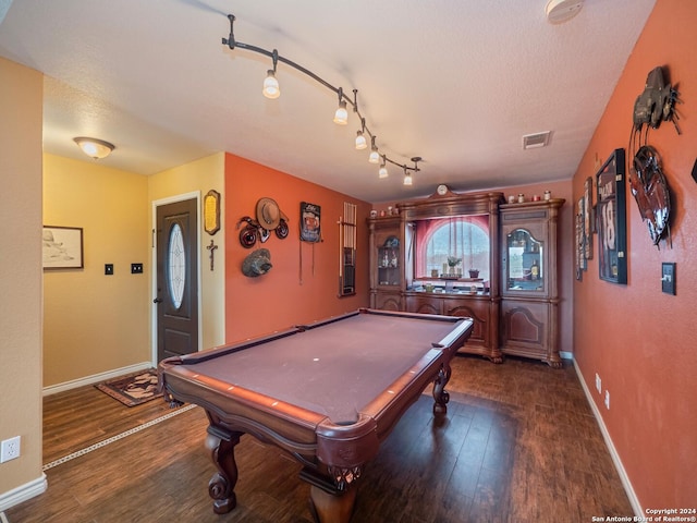 rec room with a textured ceiling, dark wood-type flooring, and pool table