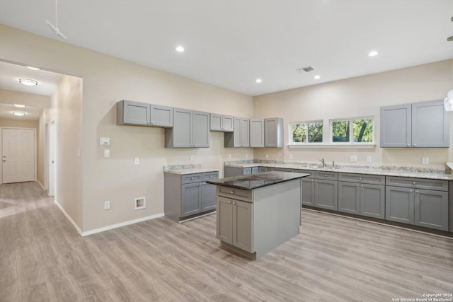 kitchen featuring gray cabinets and a kitchen island