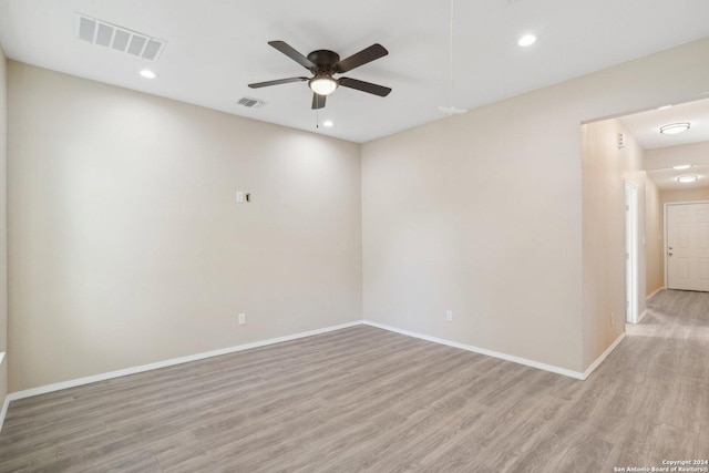 unfurnished room with ceiling fan and light hardwood / wood-style flooring