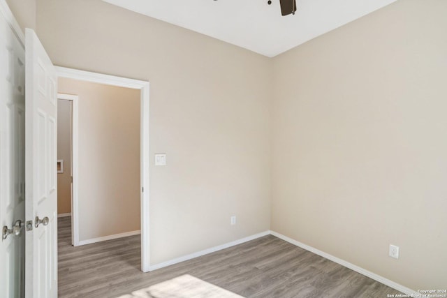 unfurnished room with ceiling fan and light wood-type flooring