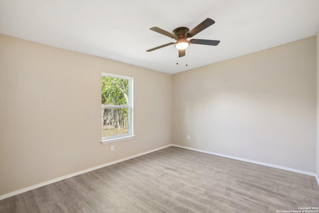 spare room with ceiling fan and light hardwood / wood-style flooring