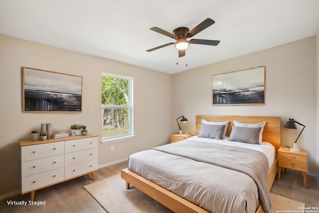 bedroom featuring ceiling fan and light hardwood / wood-style floors