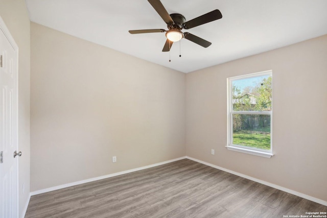 unfurnished room featuring ceiling fan and light hardwood / wood-style floors