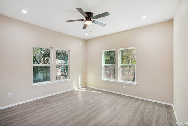 unfurnished room featuring ceiling fan and wood-type flooring