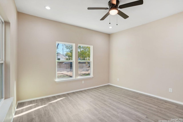 spare room with ceiling fan and light hardwood / wood-style flooring