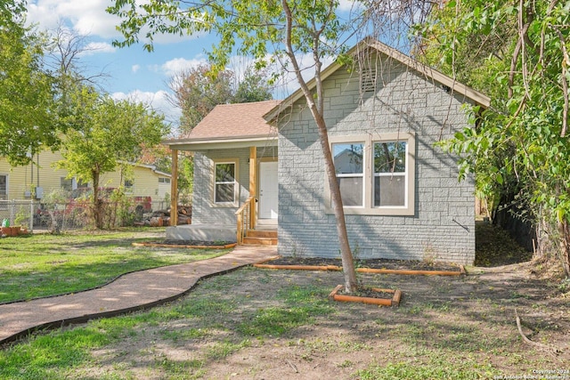 view of front of home with a front lawn