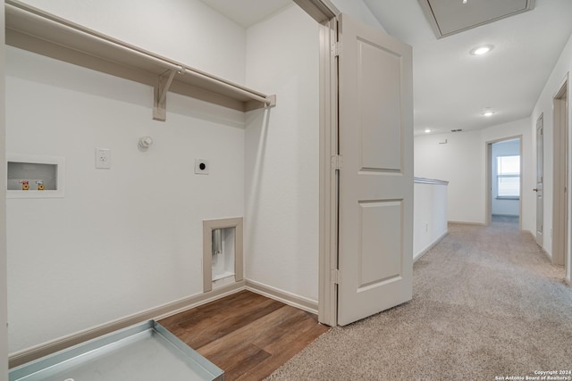 washroom featuring washer hookup, hardwood / wood-style flooring, gas dryer hookup, and electric dryer hookup