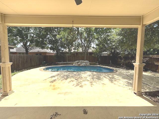 view of swimming pool with a patio