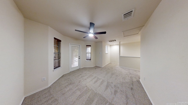 unfurnished room featuring ceiling fan and light colored carpet