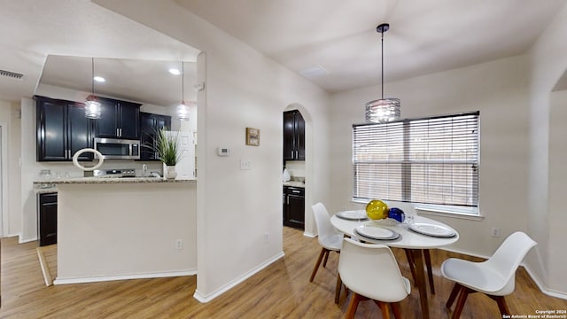 dining area with light wood-type flooring