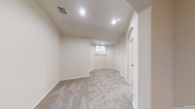 basement with light colored carpet