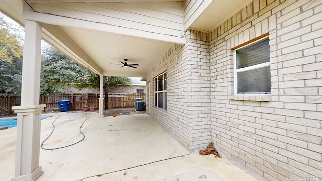 view of patio with ceiling fan and cooling unit