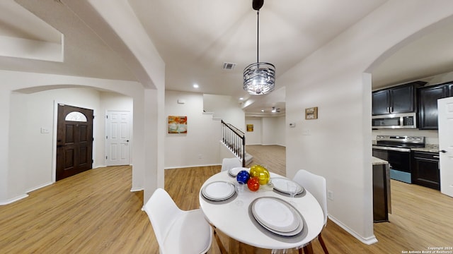 dining room with light wood-type flooring