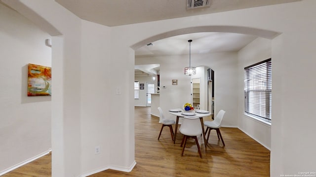 dining room featuring wood-type flooring