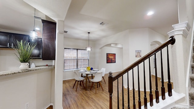 stairs with hardwood / wood-style flooring