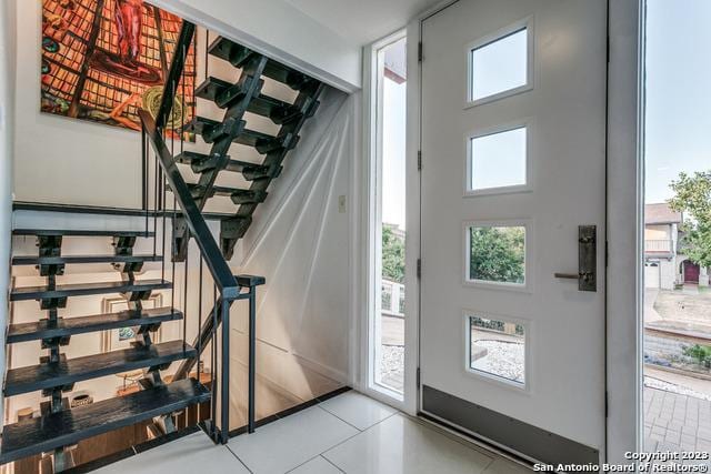 entrance foyer with light tile patterned flooring