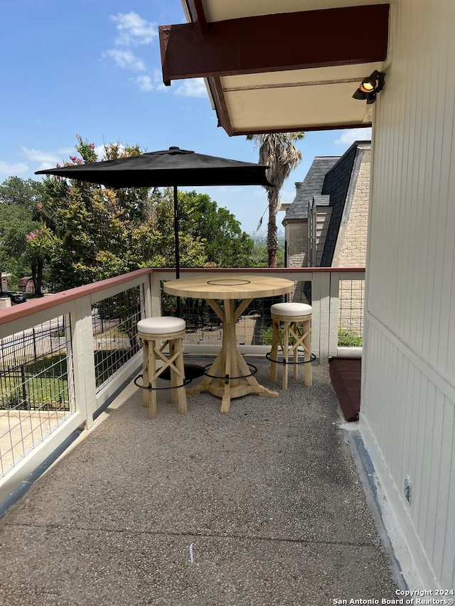 view of patio with a balcony