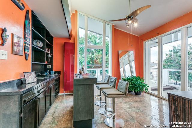 kitchen featuring a wealth of natural light and ceiling fan