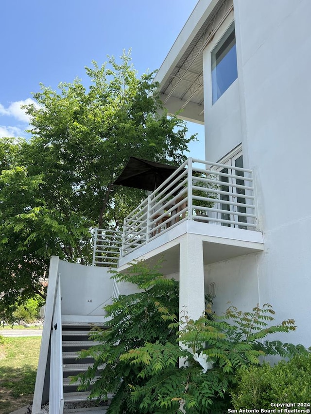 view of home's exterior with a balcony