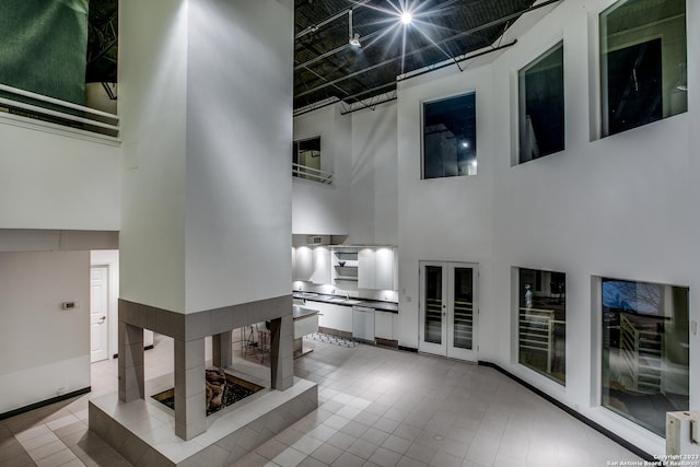 living room with a towering ceiling