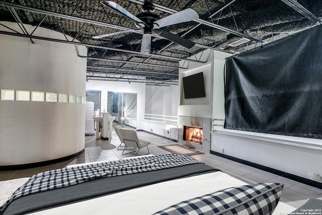 tiled bedroom with ceiling fan