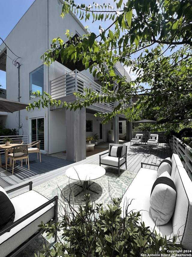 view of patio / terrace with outdoor lounge area and a deck