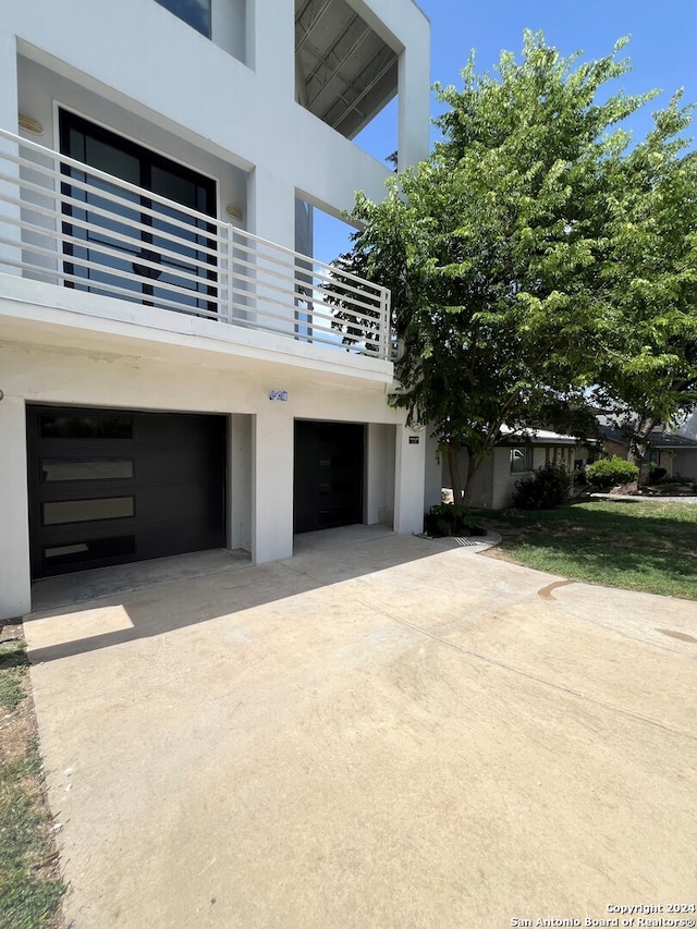 view of side of home with a garage