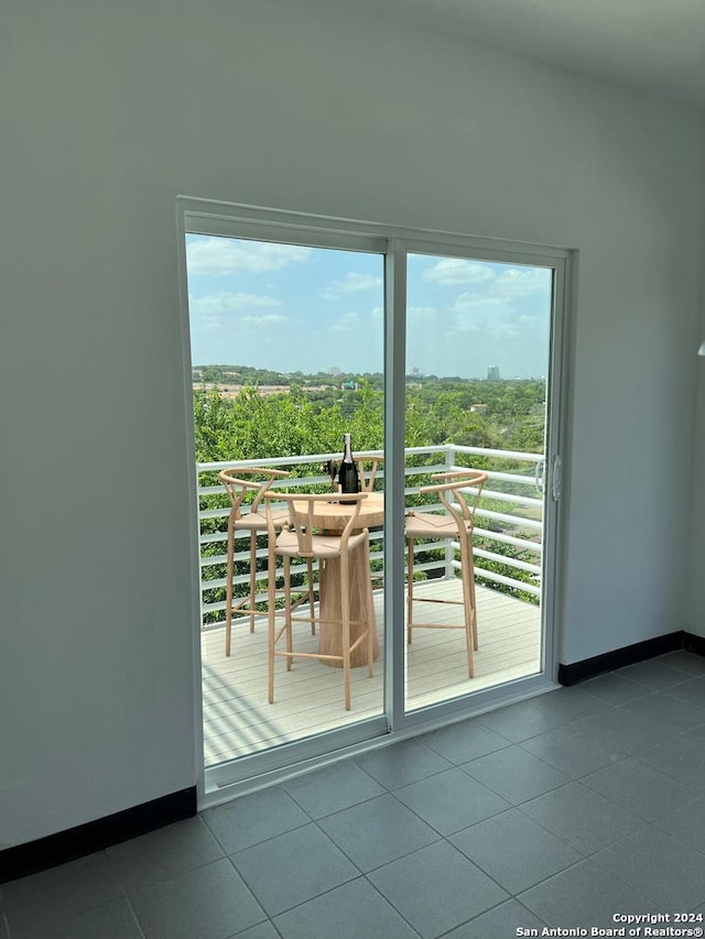 doorway featuring tile patterned flooring and plenty of natural light