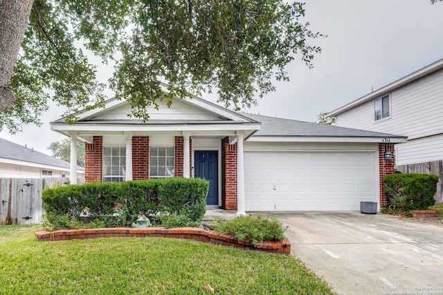 view of front of property featuring a garage and a front lawn