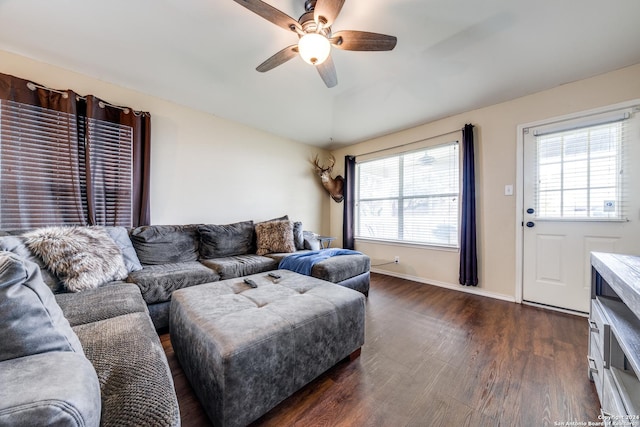 living room featuring dark hardwood / wood-style flooring, plenty of natural light, and ceiling fan