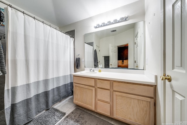 bathroom featuring tile patterned floors and vanity