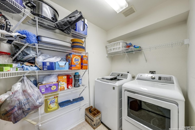 laundry room featuring washer and clothes dryer